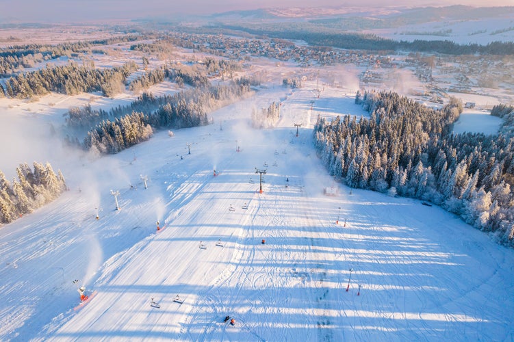 photo of drone view at ski slope in kotelnica, Zakopane, Poland at cold sunny winter day.