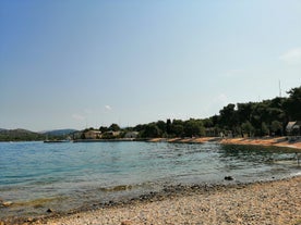 Photo of aerial view of Brodarica village near Sibenik beach and coastline, Dalmatia region of Croatia.