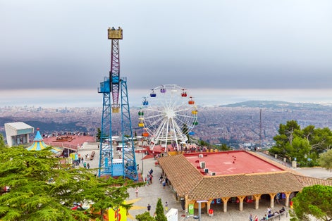 Photo of Barcelona city from mountain top Tibidabo. Catalonia, Spain.