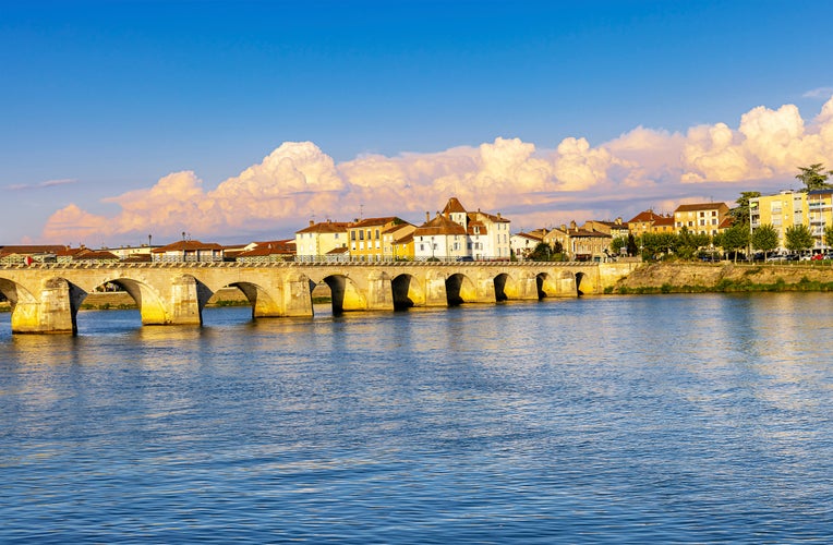 photo of view of Mâcon, France, bridge over the Saone at sunset, south of Bourgogne.