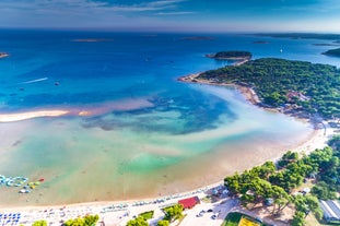 Photo of aerial view of beautiful town of Medulin waterfront view, Istria region of Croatia.