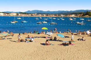 Photo of cityscape of French border town Hendaye, as seen from Spanish Hondarribia, with Famous Rhune Mount at Background, France.