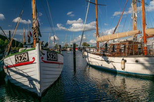 Scenic summer view of Nyhavn pier with color buildings, ships, yachts and other boats in the Old Town of Copenhagen, Denmark