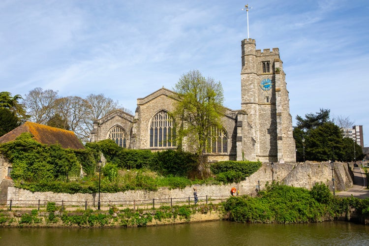 Photo of the view across the River Medway of All Saints Church in the town of Maidstone in Kent, UK.