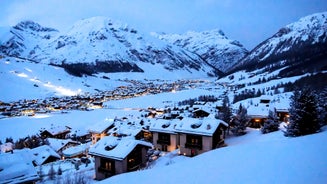 Photo of aerial view of Livigno town covered in snow in winter, Italy.