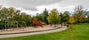 Photo of Large children playground area with slides, bars, swings and other equipment in Hazlehead park, Aberdeen, Scotland .