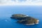 Photo of beautiful aerial view of green Island Lokrum Near Dubrovnik Surrounded by a Big Blue Sea, Sailboats, Boats and a Yacht.