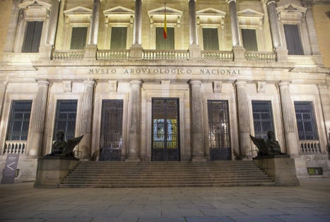 photo of facade building at night of National Archaeological Museum in Madrid, Spain.