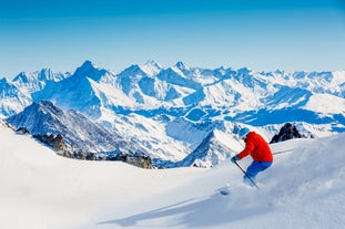 Photo of The winter view on the montains and ski lift station in French Alps near Chamonix Mont-Blanc.