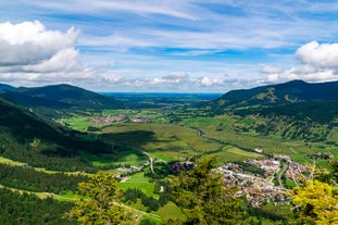 photo of Unterammergau town in beautiful autumnal nature and blue sky with clouds in Bavaria, Germany.