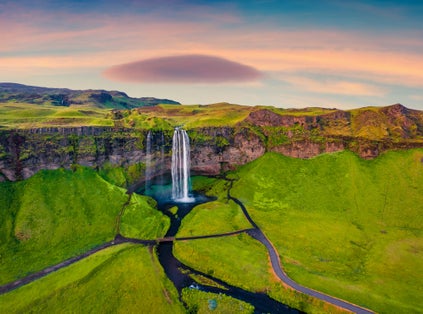 photo of breathtaking morning view from flying drone of Seljalandsfoss waterfall. Fantastic summer sunrise in Iceland, Europe. Beauty of nature concept background.
