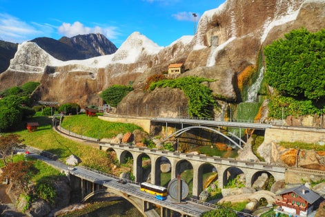 photo of Swissminiatur park in Melide, is an open-air museum with the most important Swiss buildings and means of transportation. Roads, bridges in Alps. Traffic and beautiful nature of Switzerland.