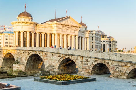 Photo of Archaeological Museum of Macedonia and famous Stone Bridge in downtown of Skopje.