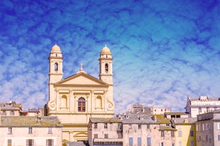 Photo of colorful houses on the shore of Bastia port, bright morning view of Corsica island, France.