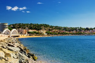 Photo of beautiful aerial view of Saint-Tropez, France with seascape and blue sky.