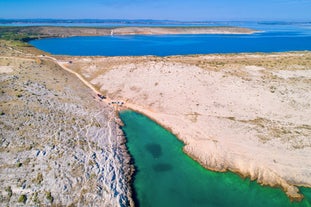 Photo of aerial view of Zaton tourist waterfront and Velebit mountain background, Dalmatia region of Croatia.