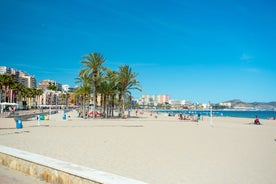 Photo of aerial panoramic view coastline and La Vila Joiosa Villajoyosa touristic resort townscape, sandy beach and Mediterranean seascape, Costa Blanca, Spain.