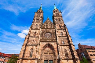 Photo of aerial panoramic view of Hohes Schloss Fussen or Gothic High Castle of the Bishops and St. Mang Abbey monastery in Fussen, Germany.