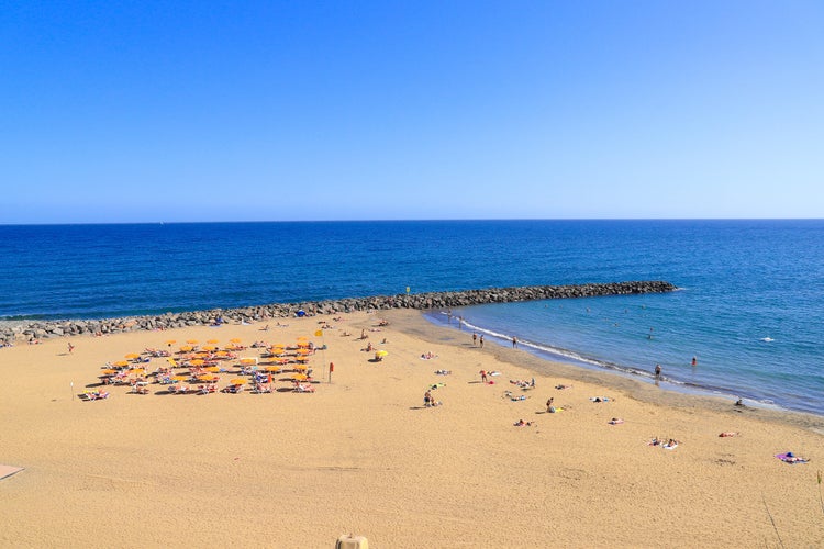 Photo of beach life at Playa Del Ingles Beach, Gran Canaria, Spain.