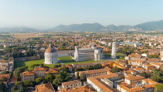 photo of pisa, Italy. The famous leaning tower and pisa cathedral in piazza dei miracoli. Summer evening hours, Aerial view.