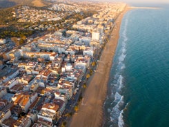 Photo of aerial view of coast at Calafell cityscape with modern apartment buildings, Spain.