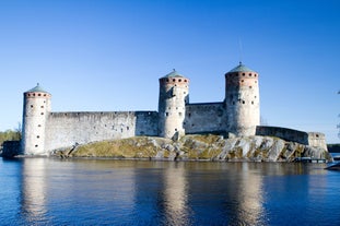 Early autumn morning panorama of the Port of Turku, Finland, with Turku Castle at background.