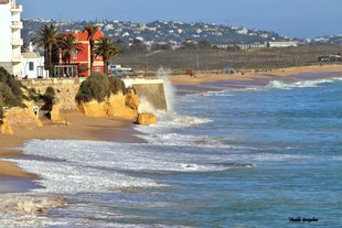 Photo of aerial amazing view of town Olhos de Agua, Algarve Portugal.