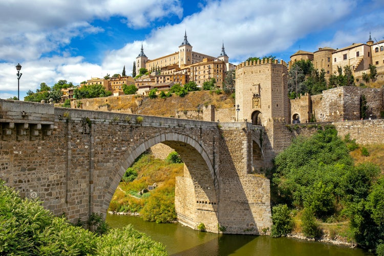 photo of view of Cityscape of Toledo with the Alcantara bridge in the forefront, Toledo, Spain