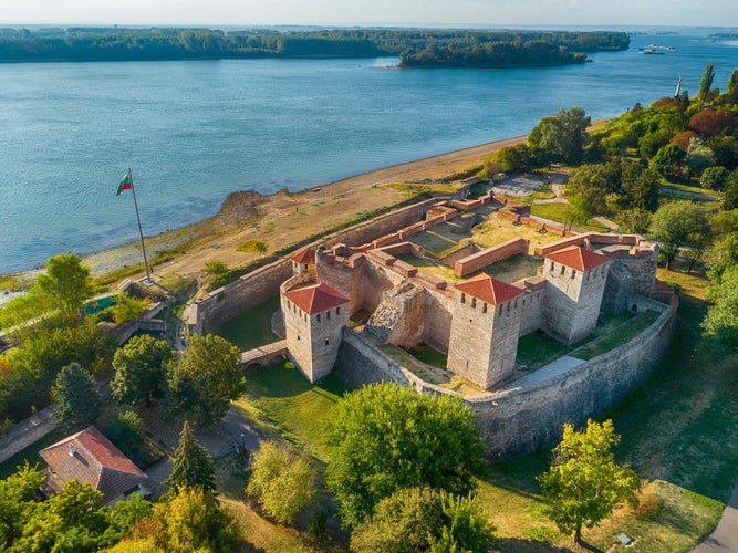 Aerial shot of Baba Vida fortress in Vidin, Bulgaria on the shore of Danube river - impressive and well preserved cultural monument under the golden light of the setting sun