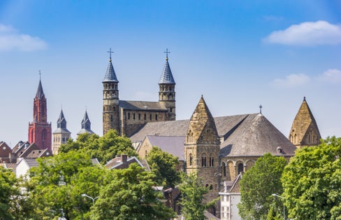 photo of Basilica of Our Lady towers in the skyline of Maastricht, the Netherlands.