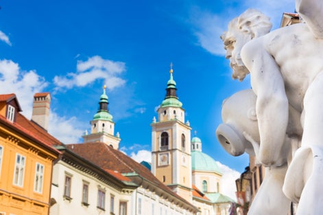 Photo of Robba fountain in Ljubljana, Cathedral and town square street on early summer morning.
