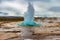 photo of the great geysir erupting in spring, Iceland.