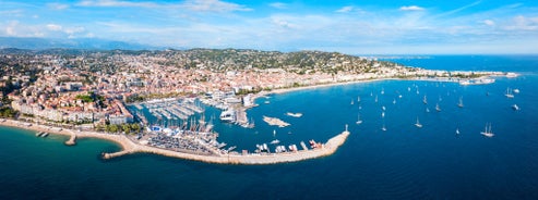 Photo of aerial cityscape view on French riviera with yachts in Cannes city, France.