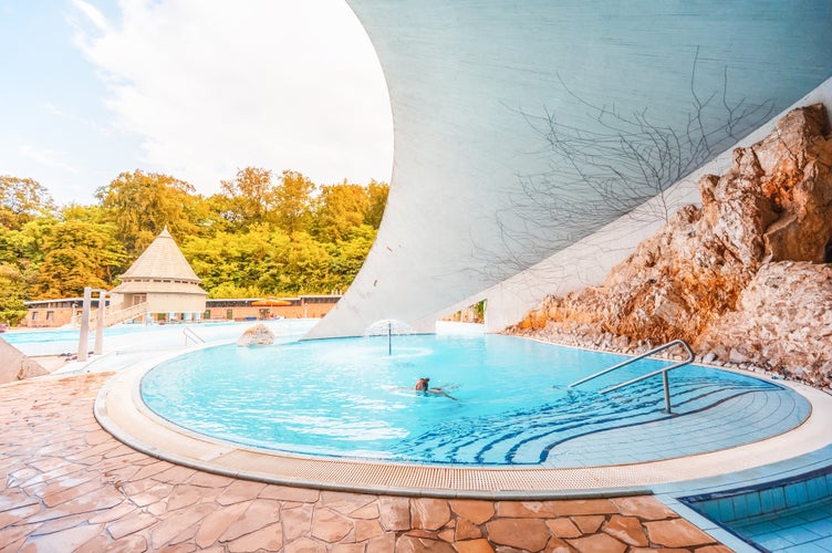 photo of view of Miskolc, Hungary - 3. june. 2022: Tourists enjoy at the cave with thermal water - natural SPA in Hungary at Miskolc Hungary