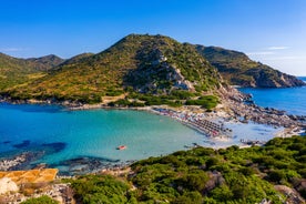 Photo of aerial view of a beautiful bay with azure sea from top of a hill, Villasimius, Sardinia island, Italy.