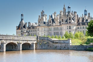 Photo of Vannes, beautiful city in Brittany, boats in the harbor, with typical houses and the cathedral in background, France.