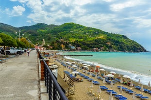 Photo of Riomaggiore with colorful houses along the coastline, one of the five famous coastal village in the Cinque Terre National Park, Liguria, Italy.