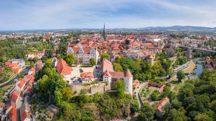 Photo of Bautzen, Germany. Aerial cityscape of Old Town with Ortenburg castle on foreground .