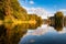 photo of low view over the water that lies next to the Vroesenpark in Rotterdam, the Netherlands during Autumn.