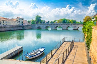 Famous buildings, gondolas and monuments by the Rialto Bridge of Venice on the Grand Canal, Italy.