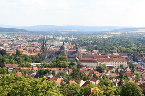 Photo of Panorama view of city Fulda with church Fulda Cathedral and Rhön mountains in the background, Germany .