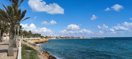 Photo of Beach seashore with wooden path to sea water in San Pedro del Pinatar