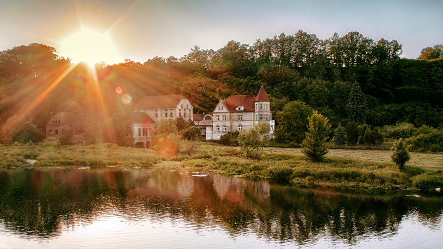 photo of view of Old mill in Dolany near to Pilsen, Czech Republic. The sunset.