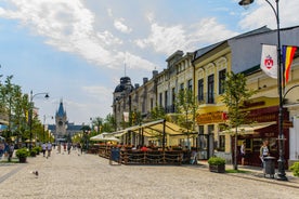 Photo of Water fountain in central square in Iasi town, Cultural Palace in background, Moldavia, Romania.