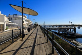 Photo of aerial view of pier fishing boats in the village Cabanas de Tavira, Portugal.