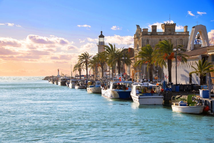 Photo of Lighthouse and old fishing port of Grau du roi in Camargue zoological nature reserve. South of France, Montpellier.