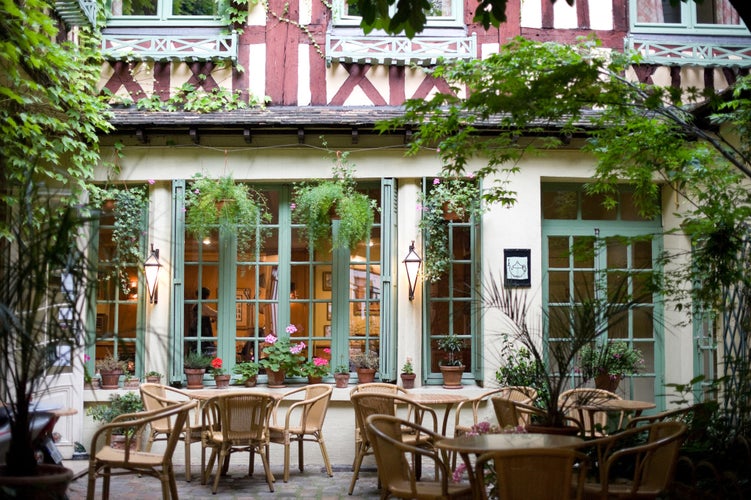 Photo of Rouen (Seine-Maritime, Haute-Normandie, France) - Court of ancient bar - restaurant at evening.