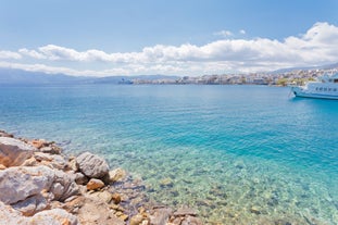 Photo of aerial view of Malia beach and small island with Church of Transfiguration, Heraklion, Crete, Greece.