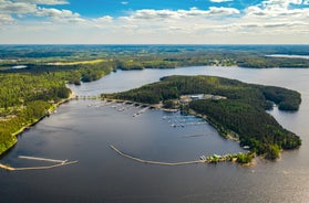 Photo of aerial view of beautiful landscape of lakes and forest in Imatra, Finland.