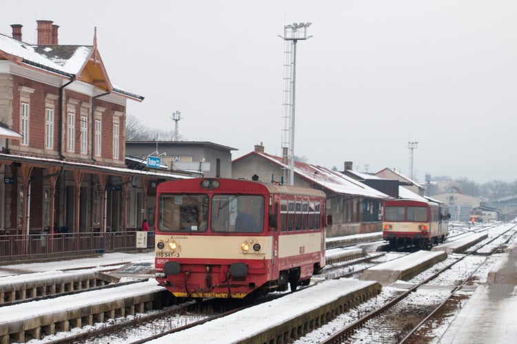 Photo of Czech old small passenger regional diesel train and its wagon in Trutnov .